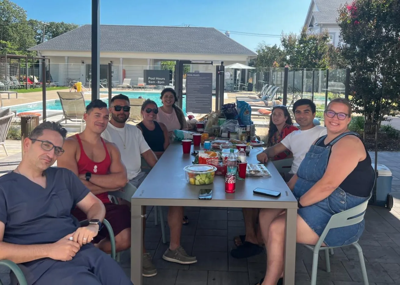 PGY-1 and PGY-2 residents at a poolside get-together